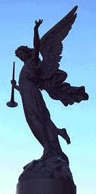 statue of angel with a horn